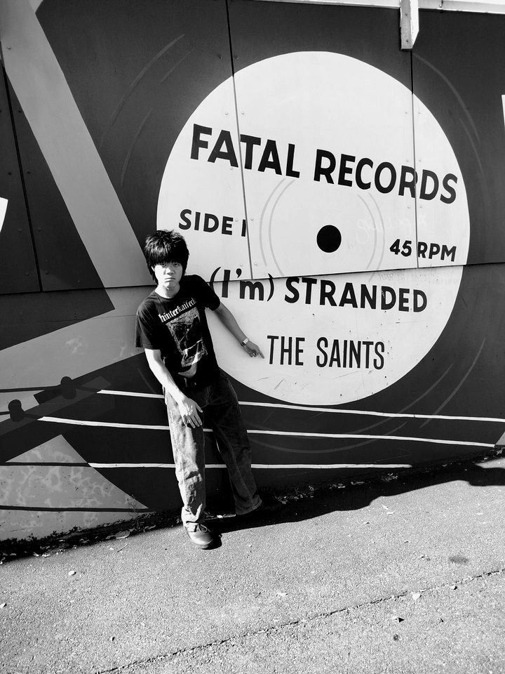 A painted mural reading The Saints, (I'm) Stranded, Fatal Records