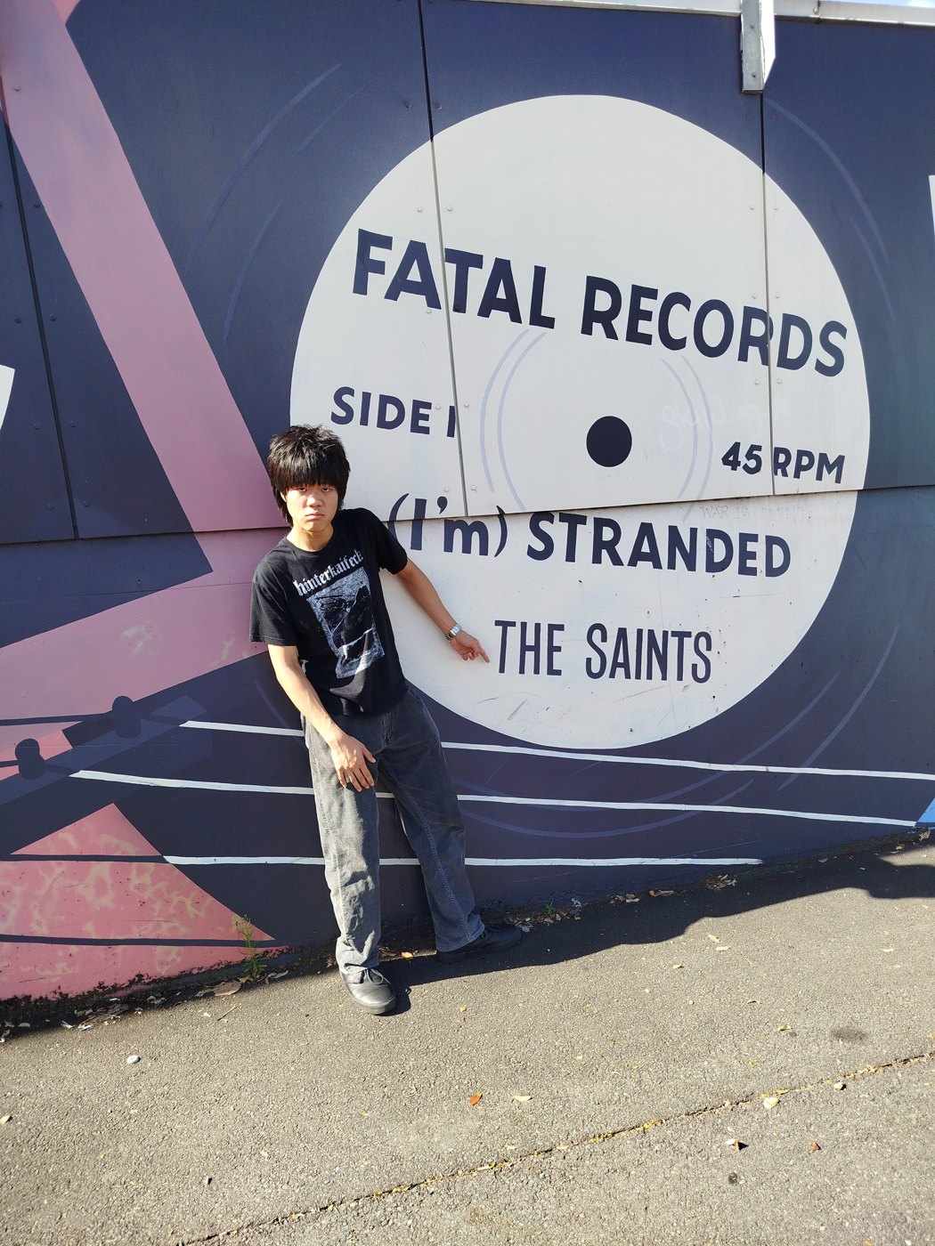 A painted mural reading The Saints, (I'm) Stranded, Fatal Records
